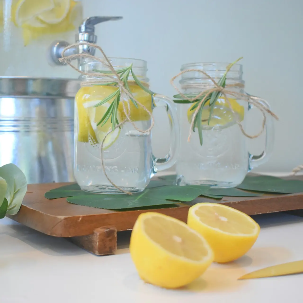 a couple of lemons sitting on top of a cutting board